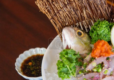 Sashimi presentation with fish head served