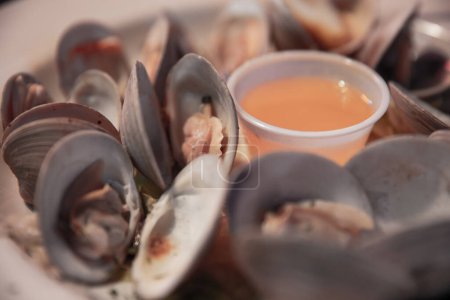 Photo for Steamed clams with butter served at a pub - Royalty Free Image
