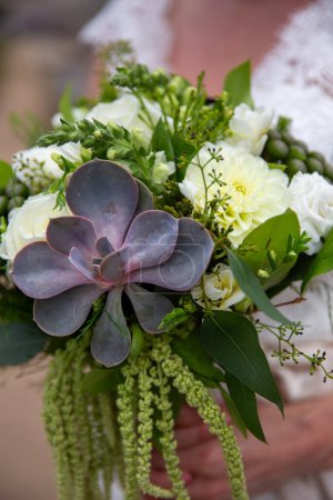 Bridal bouquet with a succulent at a desert wedding