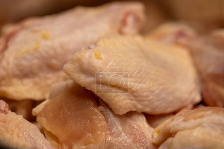 Unseasoned raw chicken wings to be fried