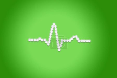 Photo for ECG wave form made of glowing medical pills against a green background. PQRST sinus rhythm shape formed from white glowing tablets. Clinical image editorial medical heart related picture. EKG cardiac trace. - Royalty Free Image