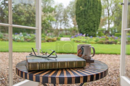 Photo for Ideford, Devon, uk. April 15th 2023. Jane Eyre, by Charlotte Bronte. The picture is set against a softly focused garden background. Selective focus on the front cover. Classic book - Royalty Free Image