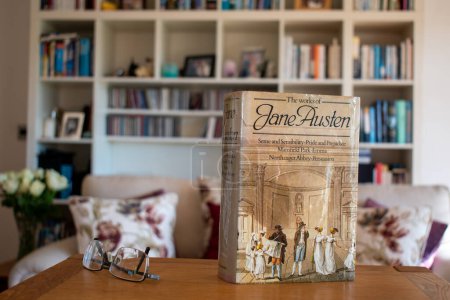 Photo for Ideford, Devon, uk. April 15th 2023. Jane Austen, The works of. The picture is set against a softly focused bookcase background. Selective focus on the front cover. - Royalty Free Image