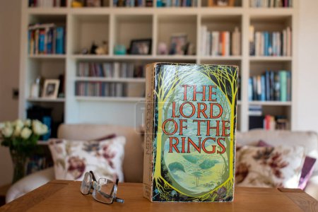 Photo for Ideford, Devon, uk. April 15th 2023. The lord of the rings, by  JRR Tolkien. The book is set against a softly focused bookcase background. Selective focus on the front cover. - Royalty Free Image