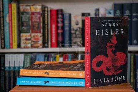 Photo for Churston, Devon, UK. December 17th 2022. Livia Lone novel by Barry Eisler. Selective focus on the E of Eisler on the front cover. The first book in a series of exceptional thrillers. - Royalty Free Image