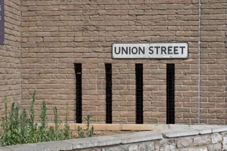 Photo for Union Street sign on wall. A common street name in black and white attached to a brick wall. Used in most towns and cities. - Royalty Free Image