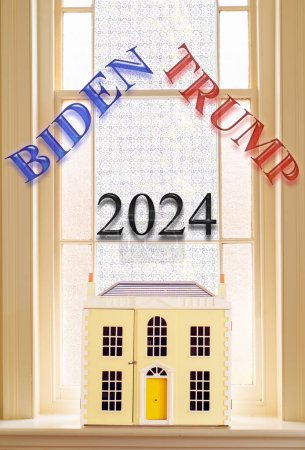 Konzeptbild Präsidentschaftswahl 2024. Die Namen Biden und Trump über einem Musterhaus auf einem Fenstersims. Amerikanisches Wahlbild.
