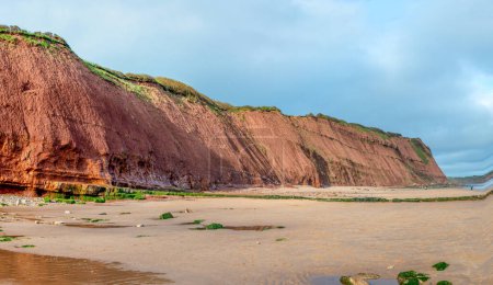 Jurassic strata panorama image of  cliffs between Exmouth and Budleigh Salterton. Sandstone with clearly visible layers. Geology and fossils. Orcombe point at a world heritage site. 