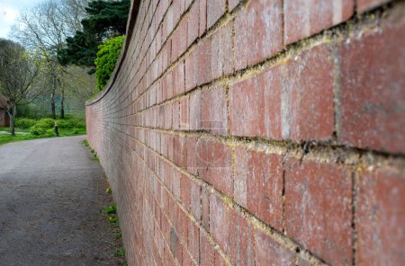 Brick wall image. Lines of red bricks with good composition and leading lines.