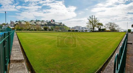 Photo for Torquay, Devon, uk. 04-24-24. Torquay bowling green panoramic picture with Torquay seafront behind. English riviera and tourism. - Royalty Free Image