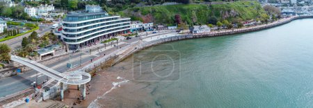 Photo for 05-01-24 Torquay, Devon, uk. Torquay seafront aerial panorama image. English riviera with cafe's, bars.Torquay marina in the background with boats and yachts . Princess theatre. - Royalty Free Image