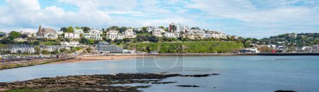 Photo for 05-01-24 Torquay, Devon, uk. Torquay seafront panorama image. English riviera with cafe's, bars. Torquay marina with boats and yachts . Princess theatre. - Royalty Free Image