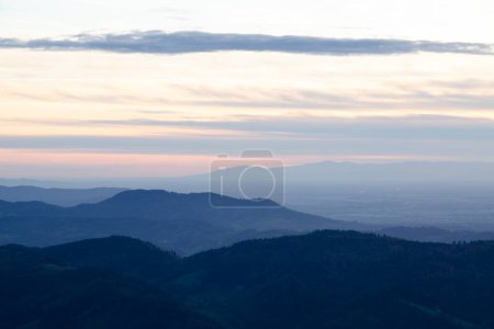 Photo for Background, texture and copy space.  Blue background. View from above and from afar of the hills and sunset sky. - Royalty Free Image