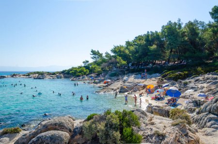 Photo for Mega Portokali Beach 08-05-2023 Greece, Halkidiki, Sithonia. Lots of people with beach umbrellas, white boulders, azure sea, blue sky - Royalty Free Image