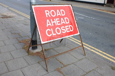 Photo for Road Ahead Closed Red sign on Pavement UK - Royalty Free Image