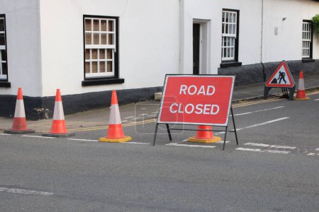 Photo for Road Closed Red sign with traffic cones UK - Royalty Free Image