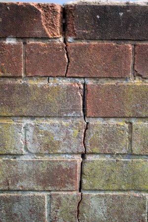 Photo for Old grungy brick wall with subsidence visible crack - Royalty Free Image