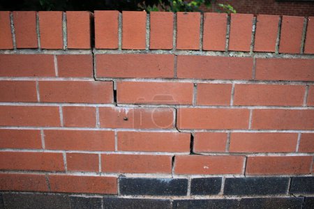 Photo for Newly constructed brick wall with subsidence damage visible cracking - Royalty Free Image
