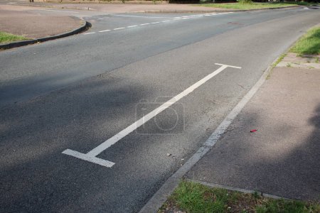 Photo for White access lines sometimes referred to as H bars to deter motorists from parking in the area - Royalty Free Image