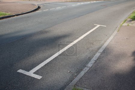 Photo for White access lines sometimes referred to as H bars to deter motorists from parking in the area - Royalty Free Image