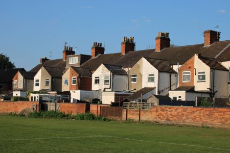 Photo for A block or victorian terrace houses clear blue sky background UK - Royalty Free Image