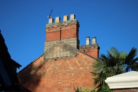 Photo for Chimney stack with 4 chimneys, Clear blue sky in background - Royalty Free Image