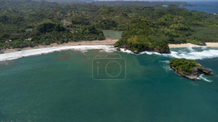 Photo for Aerial View of the appearance of Ungapan Beach where there are cliffs and rivers that meet at the beach - Royalty Free Image