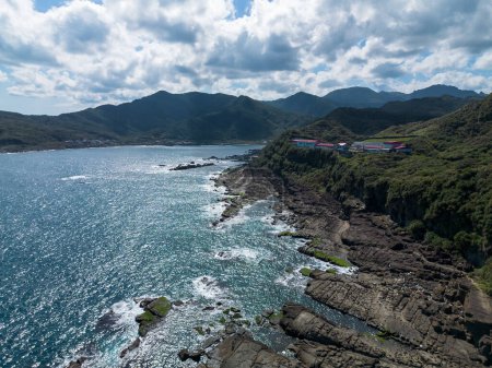 Photo for Aerial view of Bitoujiao lighthouse, a famous scenery of Taiwan northeast corner. Birds eye view in Bitoujiao cape, Ruifang district, New Taipei, Taiwan. - Royalty Free Image