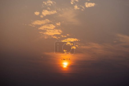 Beautiful dusky view of the setting sun during sunset in the evening. Sunset scenes with clouds in the sky.