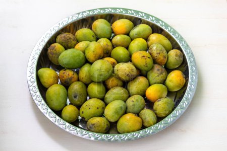 Steel plate full of ripe mangoes. Delicious fruits.