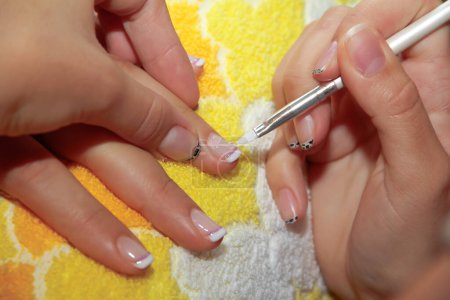 Photo for Nail extension at beauty salon close-up - Royalty Free Image