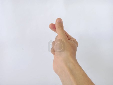 Photo of hands forming a love symbol using the thumb and index finger on a white background, Korean symbol