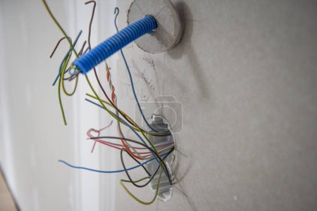 Photo for Installing and assambly of a voltage socket, planing of electric wiring - Royalty Free Image
