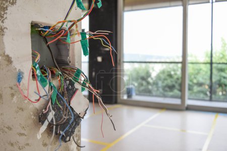 Photo for Installing and assambly of a voltage socket, planing of electric wiring - Royalty Free Image