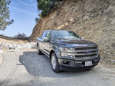 Photo for Beverly hills, los angeles, california, united states - 05.25.19 - ford f150 pickup truck at the end of the road to the hollywood sign - Royalty Free Image