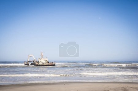 Photo for Sunken boat at the coastline of the skeleton coast in namibia - Royalty Free Image