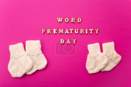 Photo for World Prematurity day concept. Banner with the inscription in wooden letters on pink background. - Royalty Free Image