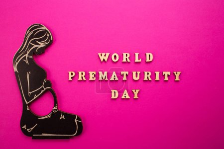 Photo for World Prematurity day concept. Banner with the inscription in wooden letters and pregnant woman.. - Royalty Free Image