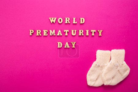 Photo for World Prematurity day concept. Banner with the inscription in wooden letters on pink background - Royalty Free Image