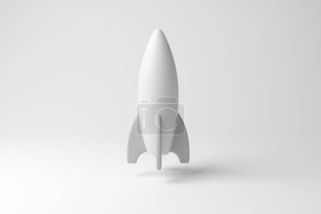 Téléchargez les photos : Vaisseau spatial blanc semblable à une fusée flottant en l'air sur fond blanc en monochrome et minimalisme. Illustration du concept d'astrologie, d'exploration spatiale et de technologie - en image libre de droit