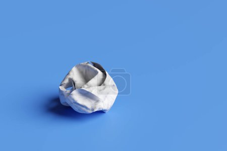 White crumpled paper ball on blue background. Illustration of the concept of frustration, failure, confusion, abandoned projects, useless ideas