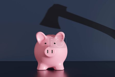 Schatten einer Axt über einem rosafarbenen Sparschwein auf dunkelblauem Hintergrund. Illustration des Konzepts von Finanzkrise, Bankrott und wirtschaftlicher Rezession