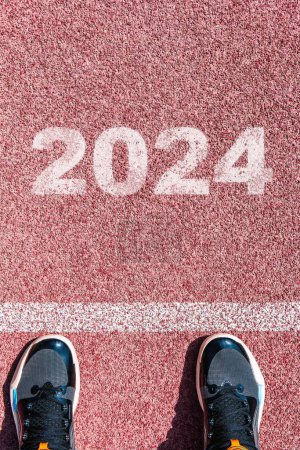 Photo for The beginning of 2024 is written on a colorful road. Conceptual photo of the coming New Year 2024. New year concept, motivation, business promotion, step forward, moving forward, hope. - Royalty Free Image