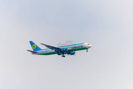 Tashkent, Uzbekistan - May 22 2023: Plane in the sky of the company "Uzbekistan Airways" (Havo yullari).