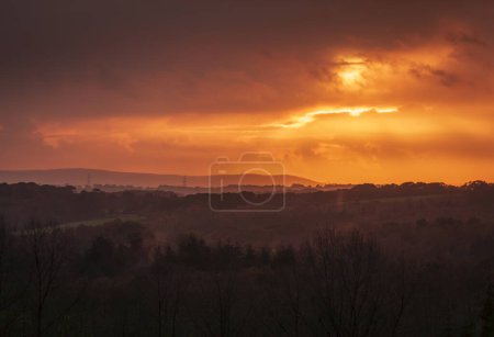 Photo for Stormy sunset over the south downs from the high weald near Dallington east Sussex south east England - Royalty Free Image