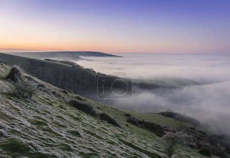 Photo for Winter sunset cloud inversion from Butts Brow on the south downs Eastbourne south east England UK - Royalty Free Image
