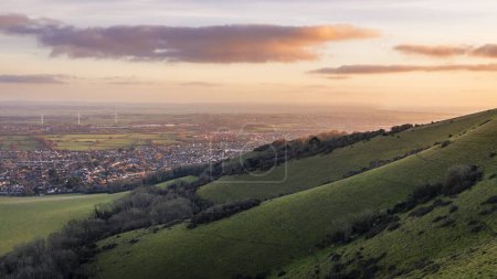 Photo for Winter sunrise over the east Sussex countryside from Combe Hilll Butts Brow Eastbourne east Sussex south east England - Royalty Free Image