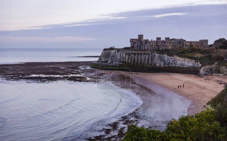 Photo for Evening blue hour view over Kingsgate bay and Kingsgate castle on the north east coast of Kent south east England UK - Royalty Free Image