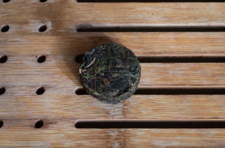 Shen Puer pressed into a circle on a tea board