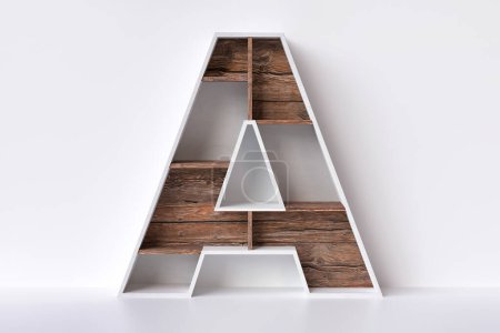 Photo for Wood letter A in the shape of a shelving unit. Nice design ideal to display books, decorative items or products for sale. High quality 3D rendering. - Royalty Free Image